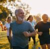Adult jogging outdoors to strengthen the heart, improve circulation, and lower the risk of hypertension and heart disease through regular exercise.