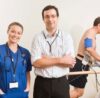 Patient walking on treadmill during TMT stress test with ECG monitoring