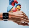 Man checking smartwatch heart rate monitoring for early heart problem detection