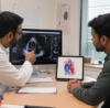 Adult patient consulting a cardiologist after diagnosis of congenital heart defect ASD or VSD through echocardiography.